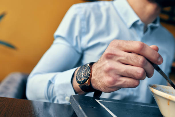 Elegant close-up shot of a luxury wristwatch showcasing its intricate design, metallic finish, and precise craftsmanship, ideal for concepts like style, punctuality, and sophistication.