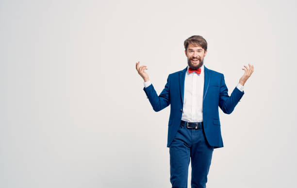 istock Handsome man in a suit red bow tie elegant style his emotions 2136568935