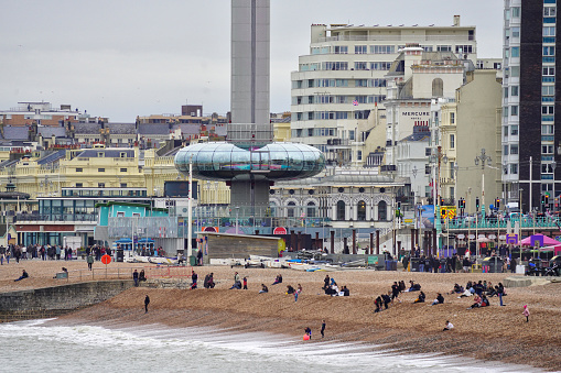Brighton, Brighton And Hove, East Sussex, Southeastern England, United Kingdom, Britain, Europe - 16th March 2024: the Brighton i360 Tower in Lower Kings Road, Brighton BN1, in the United Kingdom. A moving observation tower at the seafront of Brighton, East Sussex, England. The Panoramic view of Brighton Beach in Brighton And Hove. The Beachfront of Brighton And Hove city in East Sussex, England.