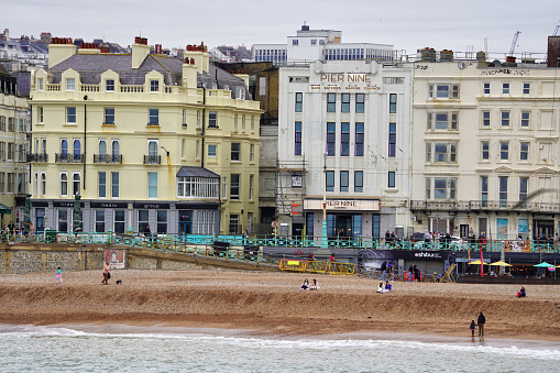 Brighton Seaside, Brighton And Hove, East Sussex, Southeastern England, United Kingdom, Britain, Europe - 16th March 2024: Brighton Beach.\n\nThe seafront of Brighton and Hove in England offers a picturesque view of the beach, making it a sought-after travel destination in the UK. With its vibrant atmosphere and charming coastal town appeal, Brighton and Hove present a panoramic view that captivates tourists from all over.\n\nStanding on Brighton Beach in the English city of Brighton and Hove, located in East Sussex, England, United Kingdom, Britain, Europe, one can admire the captivating urban skyline of this coastal town. The panoramic city view showcases the charming buildings and vibrant atmosphere that define Brighton's unique character.