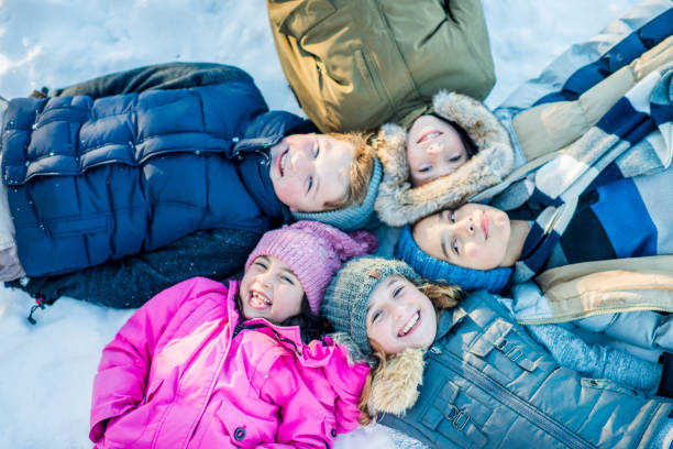 istock Children in the Snow Portrait 2136634832