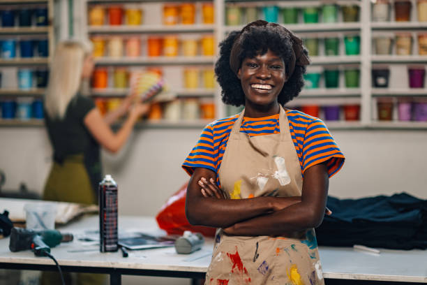 istock Confident female interracial print shop worker smiling at the camera. 2136635342