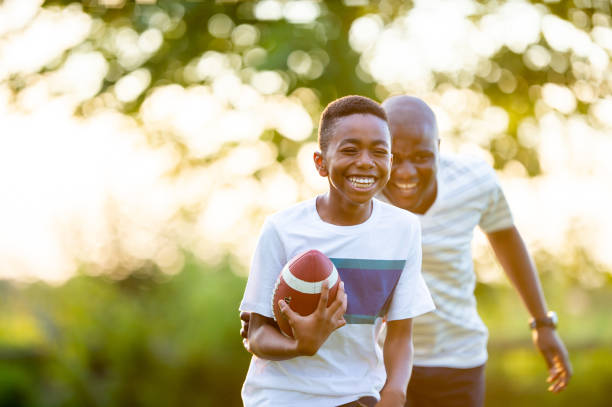 istock Football With Dad 2136636943