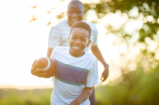 istock Football With Dad 2136636949