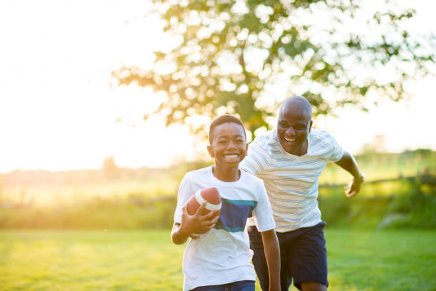 istock Football With Dad 2136637477