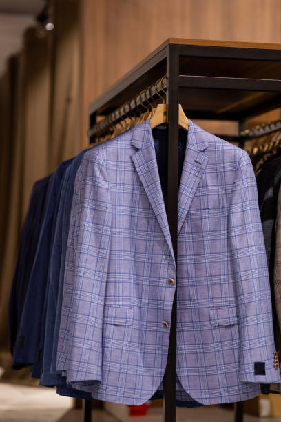 istock Hanger with various stylish men's suits. 2136641899