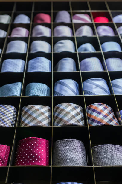 istock Twisted neckties beautifully stacked at shop window 2136641907