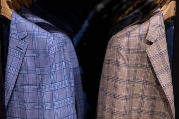 Hanger with various stylish men's suits.