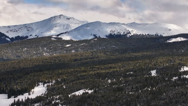 Vail Pass Colorado Rocky Mountain backcountry high altitude ski snowboard backcountry avalanche terrain peaks national forest winter spring snowy peaks evening clouds sunset upward motion