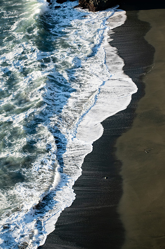 Waves alongside coastal beach