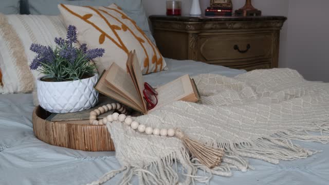 Cozy bedroom with comforter and pillows, panning left to right