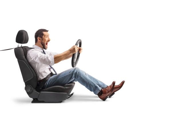 istock Shocked driver in fear holding a steering wheel and shouting 2136756028
