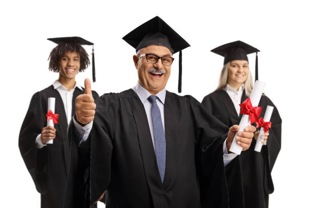 Graduation students and a mature man holding certificates and gesturing thumbs up isolated on white background