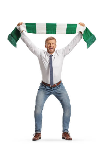 istock Businessman cheering with a green and white scarf 2136756586