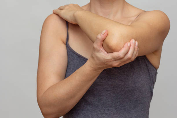 istock Woman hands joint pain in elbow 2136759796
