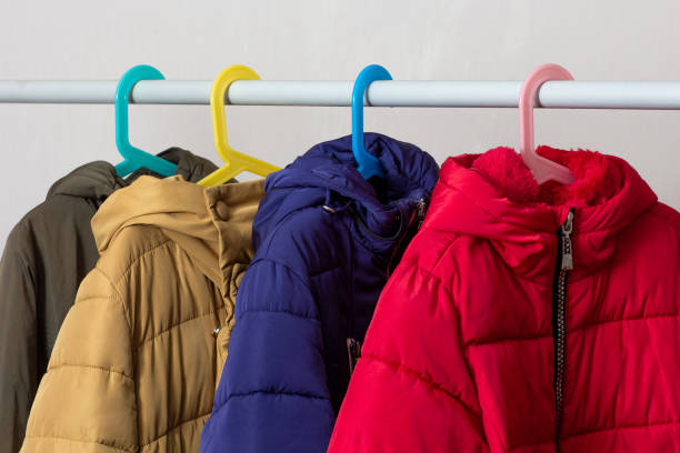 istock Rank of puffer coats hanging 2136759808
