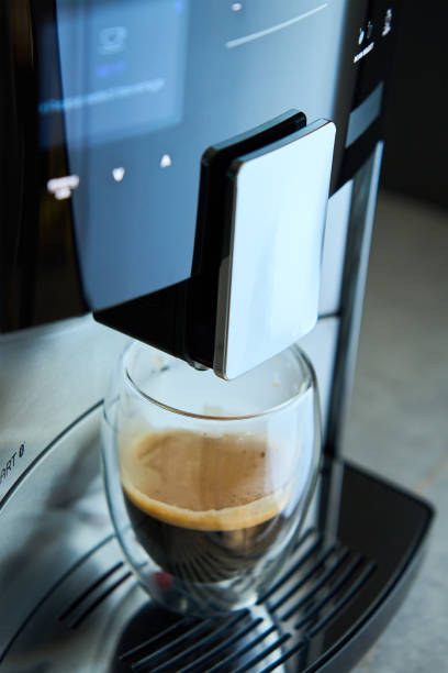 istock Coffee machine with fresh espresso in glass cup 2136761999