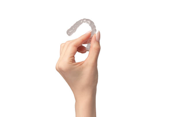 istock Transparent mouth guard in a woman's hand isolated. 2136763614