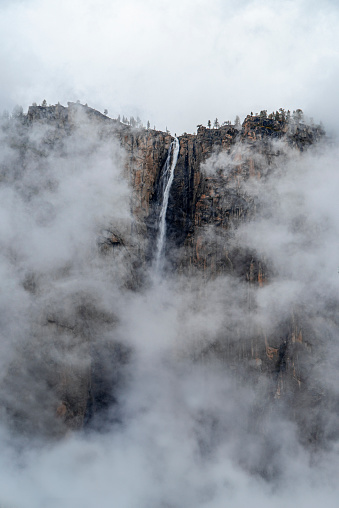 Yosemite Falls shrouded in mist. Yosemite Valley, California, USA.