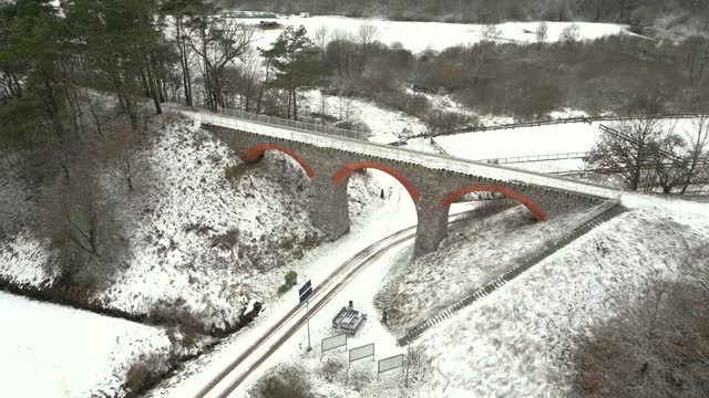 Historic railway viaduct in a winter setting