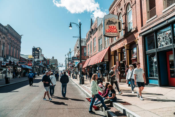 Beale Street bustling with tourists on a hot summers day in April 2023. Memphis, Tennessee, USA.
