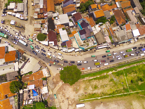 Congestion due to Eid homecoming traffic. Top view of traffic jam at road junction, Bandung - Indonesia. Transportation Industry. Above. Inter-city road access. Shot from a drone.