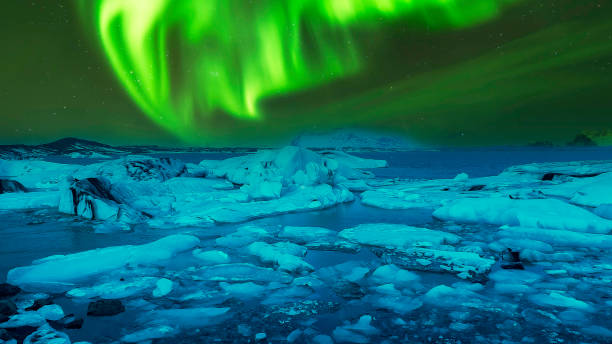 istock Aurora Northern lights over snowy mountains 2136962263