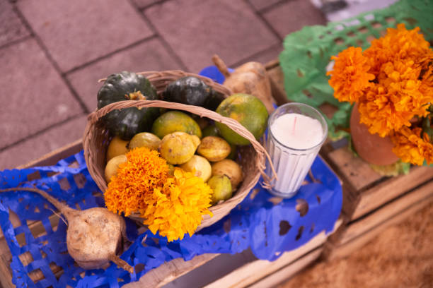 This is a close up of basket full of food displayed as an offering for Dia de los Muertos in Playa del Carmen, Mexico.