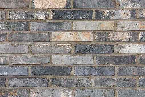 Reclaimed Brick wall background with gray joints. Brick texture