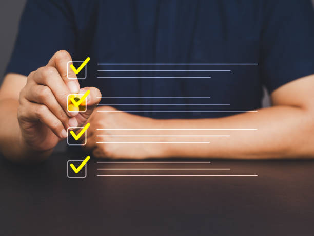 istock Businessman uses a pen to tick the correct sign mark for a quality document control checklist, and the business approves the project concept. 2137025053