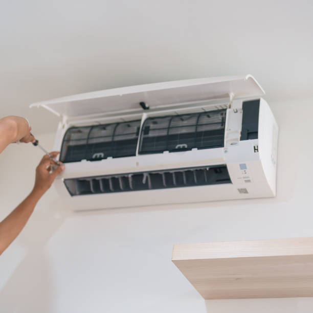 istock Man technician maintenance air conditioner. Purification system for cleaning dust PM2.5 and virus in home. Repair, Washing, Conditioning Service, Allergy, Pure air, health, Wellness and Air Pollution 2137045295