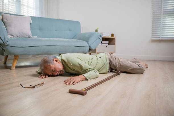 istock Older senior man headache lying on the floor after falling 2137050516