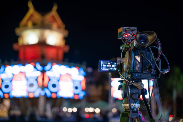 istock Behind-the-scenes video production at live event. Professional crew captures performance on stage using high-tech equipment. Multimedia expertise in streaming and cinematography give me. 2137050572