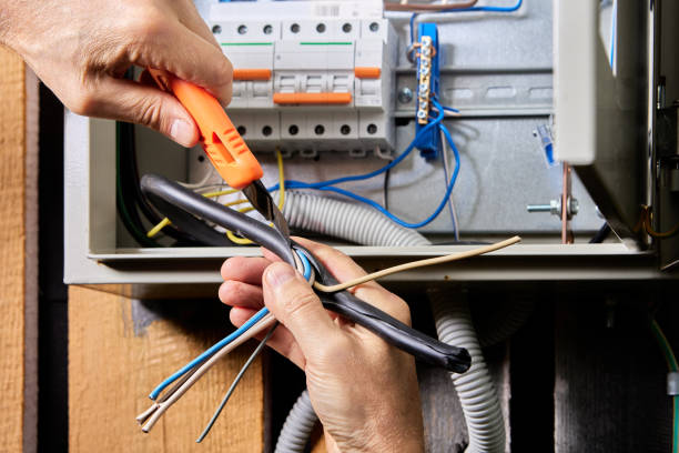 istock Connecting  3 phase, 4 wire power cable to electrical panel, removing top PVC covering. 2137098209