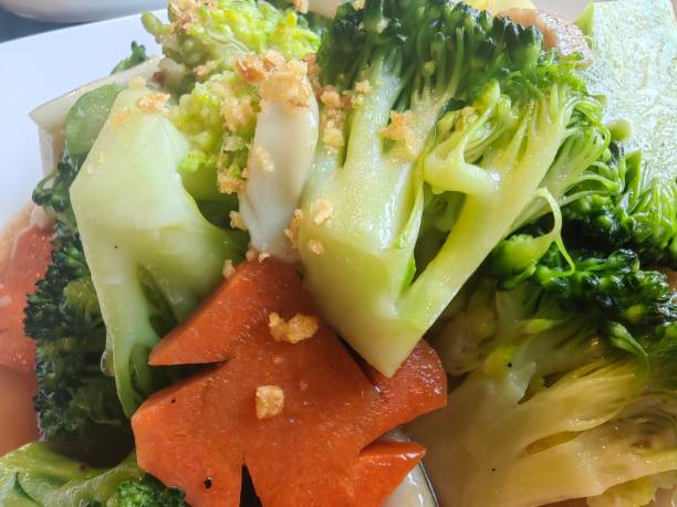 istock Fresh salad in a bowl: garlic vegetables and carrot 2137108676