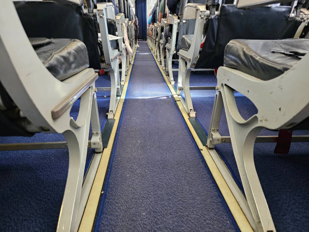 istock Empty Seats on an Airplane With Blue Carpet 2137121846
