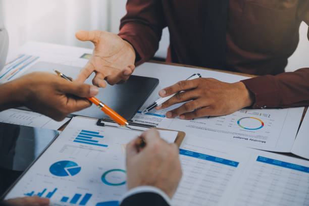 istock Business team working with new startup project plan and discussion information for financial strategy with laptop and digital tablet in a modern business lounge. 2137138846