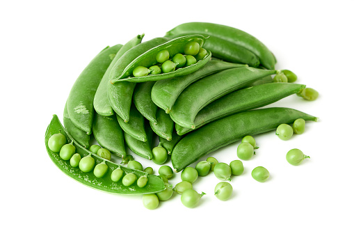 Pile of Sugar snap pea and peeled with seed inside isolated on white background. sugar snap pea belong to the leguminosae family. hard pods, seed large and pods are thick. sweet and crisp.