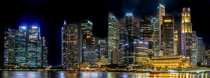 Singapore, 24 January 2024: Singapore's Marina Bay district illuminates night, glow of skyscrapers. vibrant lights transform cityscape into mesmerizing spectacle of urban brilliance and modernity