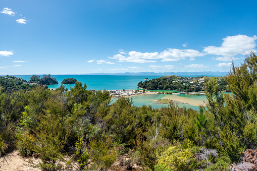 Iconic Beauty of Kaiteriteri Beach: A Panoramic View of its Golden Sands and Crystal-Clear Waters, a Beloved Summer Destination in New Zealand