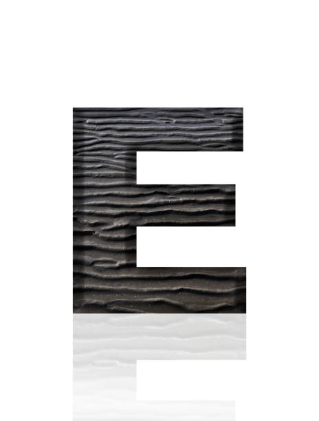 Close-up of three-dimensional mud flat pattern alphabet letter E on white background.
