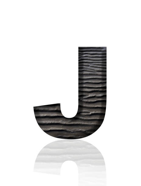 Close-up of three-dimensional mud flat pattern alphabet letter J on white background.