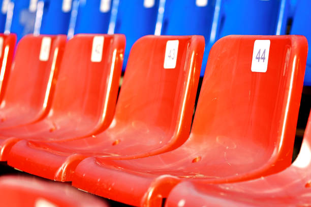 istock Empty seats in a stadium, close-up. Blue and red seats 2137238341