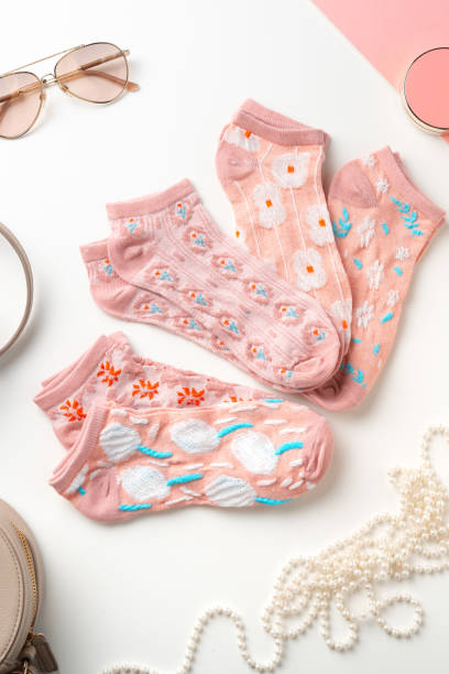 istock Pastel composition with pink socks on white background 2137240396