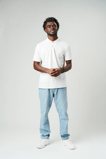 istock Man Standing in White Shirt and Jeans 2137244727