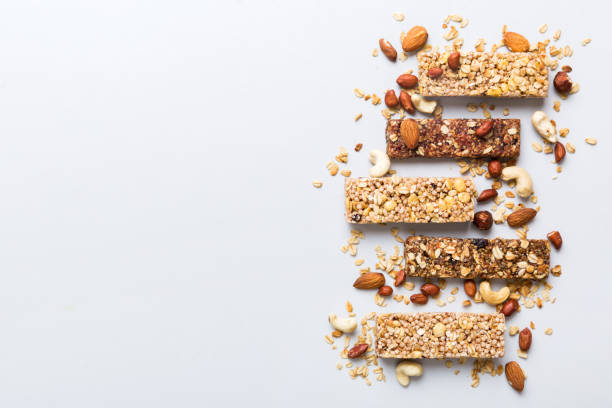 istock Various granola bars on table background. Cereal granola bars. Superfood breakfast bars with oats, nuts and berries, close up. Superfood concept 2137272914