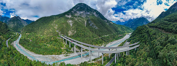 Aerial view of toll highway passing through the mountains of Italy