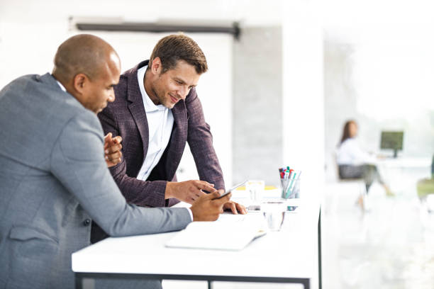istock Male entrepreneurs working on digital tablet in the office. 2137302238