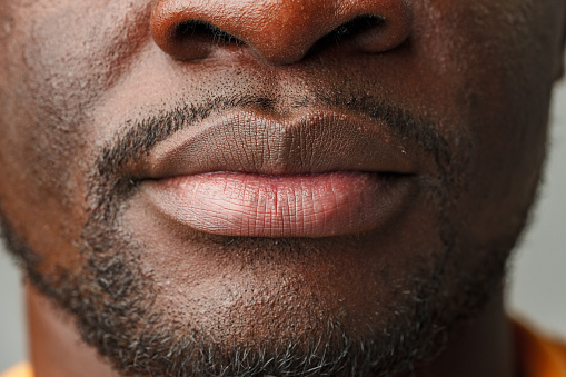 Close-Up of African Mans Lower Face and Lips studio shot