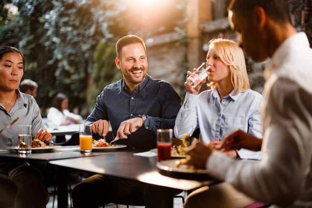 istock Happy business colleagues talking on a lunch in a restaurant. 2137321796